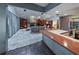 Vast open floorplan featuring a bar area, living room, and a glimpse of the kitchen at 2020 Venetian Way, Winter Park, FL 32789