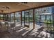 Beautiful porch and patio area with lake view and gazebo, shaded by Spanish moss at 2020 Venetian Way, Winter Park, FL 32789