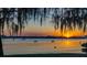 Scenic lake view at sunset, with kayakers enjoying the water at 2020 Venetian Way, Winter Park, FL 32789
