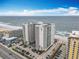 High-rise condo building features an oceanfront view, meticulously landscaped surroundings, and private parking at 2055 S Atlantic Ave # 1604, Daytona Beach, FL 32118