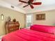 A cozy bedroom featuring two twin beds, dresser, and a bright decor at 2055 S Atlantic Ave # 1604, Daytona Beach, FL 32118