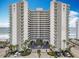 Stunning exterior view of the beachfront condo building with ocean views from multiple balconies at 2055 S Atlantic Ave # 1604, Daytona Beach, FL 32118