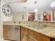 Kitchen with granite countertops, stainless steel dishwasher, and a kitchen sink at 2055 S Atlantic Ave # 1604, Daytona Beach, FL 32118