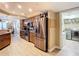 Modern kitchen with stainless steel appliances, wooden cabinetry, and granite countertops at 2055 S Atlantic Ave # 1604, Daytona Beach, FL 32118