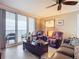Relaxing living room with comfortable leather chairs and a beautiful ocean view from the balcony at 2055 S Atlantic Ave # 1604, Daytona Beach, FL 32118