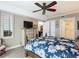 Comfortable main bedroom features a decorative dresser, ceiling fan, and an ensuite bathroom for added convenience at 2055 S Atlantic Ave # 1604, Daytona Beach, FL 32118
