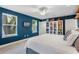Spacious bedroom features an ensuite bathroom, two windows, and built-in bookcase perfect for storage and style at 2109 E Central Blvd, Orlando, FL 32803