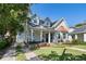 Charming two-story home with landscaped yard, stone driveway, copper awning and covered porch in a quiet neighborhood at 2109 E Central Blvd, Orlando, FL 32803