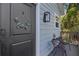 Welcoming front door with stylish wreath, exterior lighting, and a cozy outdoor seating area on a quaint porch at 2109 E Central Blvd, Orlando, FL 32803