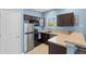 Efficient kitchen featuring stainless steel appliances and granite countertops, maximizing space at 2109 E Central Blvd, Orlando, FL 32803