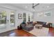 Bright living room showcasing a sectional sofa, accent rugs, natural light, and easy access to the outdoors at 2109 E Central Blvd, Orlando, FL 32803
