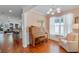 Cozy room with piano, chair and decor at 2109 E Central Blvd, Orlando, FL 32803