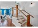 Hallway with oak and white staircase leading to the upstairs at 2109 E Central Blvd, Orlando, FL 32803
