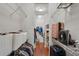Long walk-in closet featuring built-in shelving and clothing rods, providing ample storage space at 2109 E Central Blvd, Orlando, FL 32803