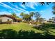 A large backyard with green lawn, trees and an outdoor patio at 2112 Shady Ln, Geneva, FL 32732