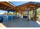 Wooden boat dock featuring a covered sitting area, bench seating, and a covered boat lift at 2112 Shady Ln, Geneva, FL 32732