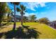 Beautiful waterfront home featuring a lush lawn, mature trees, and a private dock at 2112 Shady Ln, Geneva, FL 32732