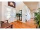 Inviting foyer with hardwood floors, decorative front doors, and natural light filtering through at 2112 Shady Ln, Geneva, FL 32732