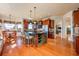 A spacious kitchen features an island with barstool seating and wooden cabinets, offering a blend of style and functionality at 2112 Shady Ln, Geneva, FL 32732