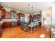 Expansive kitchen with hardwood floors, dual-tone cabinetry, and modern appliances at 2112 Shady Ln, Geneva, FL 32732