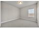 Neutral bedroom features carpet floors, a window, and a built-in closet for a clean and bright space at 2291 Raven Ridge Rd, Minneola, FL 34715