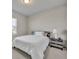 Bedroom with neutral carpet, a window and a nightstand on the side of the bed at 2291 Raven Ridge Rd, Minneola, FL 34715