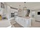Bright kitchen with quartz countertops, stainless steel appliances, and a spacious center island at 2291 Raven Ridge Rd, Minneola, FL 34715
