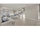 Bright living room featuring an open layout with tiled floors and neutral color palette at 2291 Raven Ridge Rd, Minneola, FL 34715