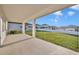Covered patio with concrete floor provides a relaxing outdoor space and backyard view at 2291 Raven Ridge Rd, Minneola, FL 34715