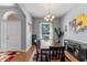Formal dining area with hardwood floors, large table, and contemporary decor at 2487 Ridgemoor Dr, Orlando, FL 32828