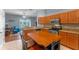 Open kitchen with granite counters, stainless appliances, and an eat-in island at 2487 Ridgemoor Dr, Orlando, FL 32828