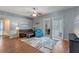 Cozy living room featuring hardwood floors and sliding glass doors to outdoor living area at 2487 Ridgemoor Dr, Orlando, FL 32828