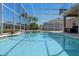 This pool provides a relaxing backyard retreat with shimmering water, landscaping and a screened enclosure at 2487 Ridgemoor Dr, Orlando, FL 32828