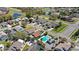 Aerial view of a neighborhood showcasing houses, pools, landscaping, and street layout at 2511 Chatham Cir, Kissimmee, FL 34746