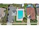 Aerial view showcasing community pool, parking, and neighborhood homes at 2511 Chatham Cir, Kissimmee, FL 34746