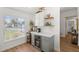Stylish bar area with cabinets, wine fridge, and shelving, creating a perfect spot for entertaining at 2511 Chatham Cir, Kissimmee, FL 34746