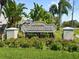 Welcome to Chatham Park, sign framed by lush greenery and vibrant flowers at 2511 Chatham Cir, Kissimmee, FL 34746