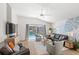 Bright living room with a view of the pool, comfortable seating, and stylish decor at 2511 Chatham Cir, Kissimmee, FL 34746