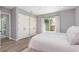 Bright bedroom with hardwood floors, closet space and natural light from the glass sliding doors at 2536 Brookshire Ave, Winter Park, FL 32792