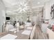 Open-concept dining area showcasing a modern chandelier and seamless flow to the kitchen and living spaces at 2536 Brookshire Ave, Winter Park, FL 32792