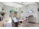 Elegant dining room with modern chandelier and plenty of natural light at 2536 Brookshire Ave, Winter Park, FL 32792