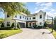 Beautiful two-story home featuring a basketball hoop and lush landscaping at 2536 Brookshire Ave, Winter Park, FL 32792