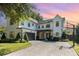 Beautiful two-story home featuring a basketball hoop and lush landscaping at 2536 Brookshire Ave, Winter Park, FL 32792