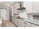 Elegant kitchen displays custom cabinets, granite countertops, stainless steel appliances, and modern tile backsplash at 2536 Brookshire Ave, Winter Park, FL 32792