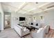 Comfortable living room with wood floors, coffered ceilings, and large windows at 2536 Brookshire Ave, Winter Park, FL 32792