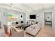 Bright living room with modern furniture, wood floors, and sliding glass doors to the backyard at 2536 Brookshire Ave, Winter Park, FL 32792