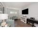 Cozy living room with hardwood floors, seating area and tv at 2536 Brookshire Ave, Winter Park, FL 32792