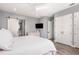 This bedroom features a ceiling fan, closet space and a TV for relaxation at 2536 Brookshire Ave, Winter Park, FL 32792