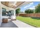 Covered patio with wicker furniture overlooking a lush, well-maintained backyard at 2536 Brookshire Ave, Winter Park, FL 32792