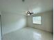 Bedroom featuring tile floors, a ceiling fan with lighting, and a window at 2751 L B Mcleod Rd # 2751, Orlando, FL 32805